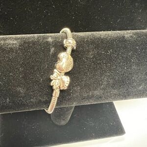 Charm bracelet with a heart with the word, mom and angel